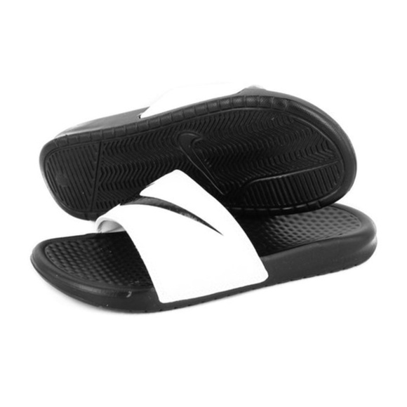 black nike slides with white swoosh